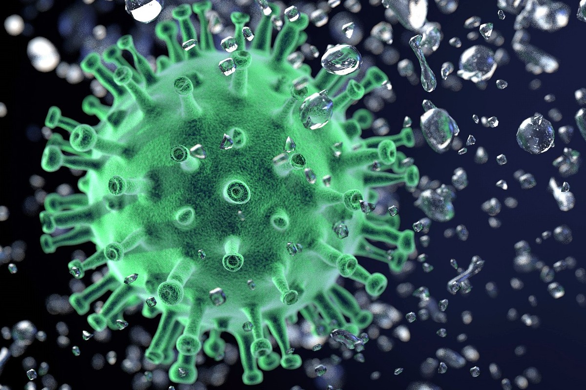 Coronavirus rodeado de gotitas.